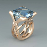 Vintage rose gold ring with blue zirconia stones