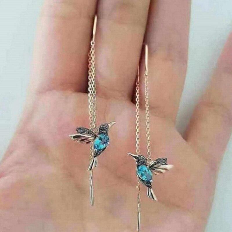Silver and zirconia earrings in the shape of a hummingbird
